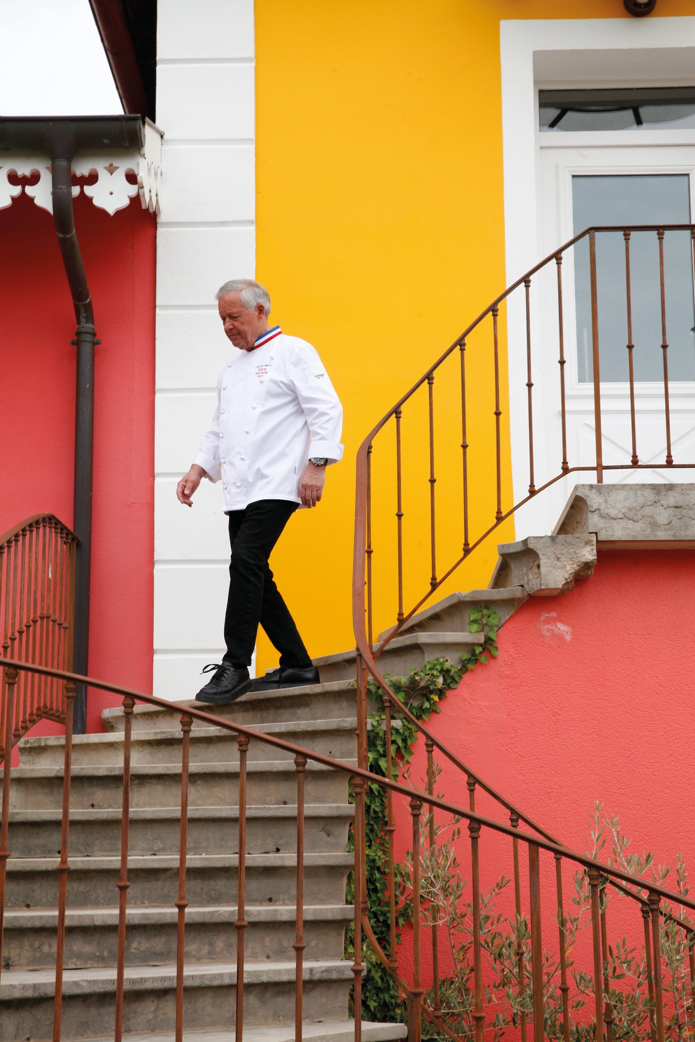 Award winning chef walking in ultra comfortable pants that he wears in the kitchen every day