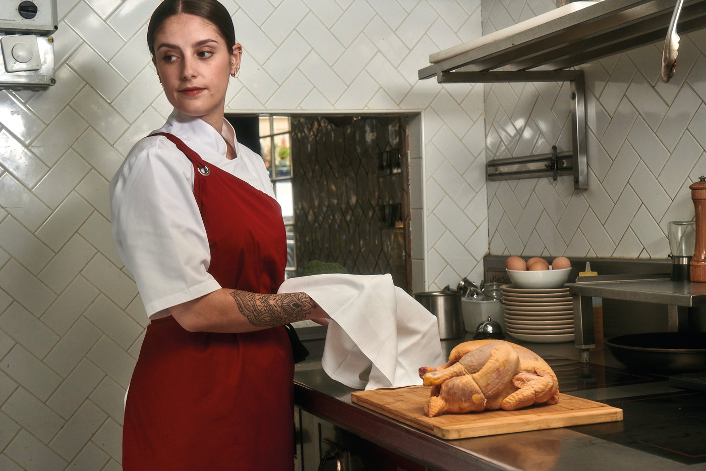 Red bib apron on sous chef