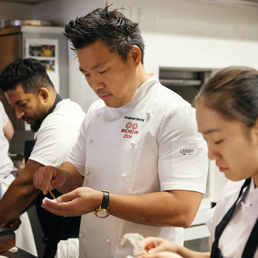 Michelin rated chef working in the kitchen wearing a Lafont Short sleeve double breasted chef jacket