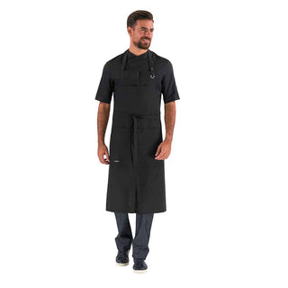 Waiter wearing a black bib apron with adjustable neck strap and ties, a bib pocket, and a large twin-compartment pocket on the chest.
