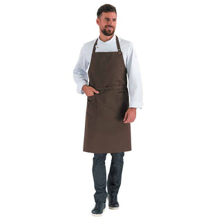 Man wearing a navy chocolate brown bib apron with adjustable neck length and waist ties