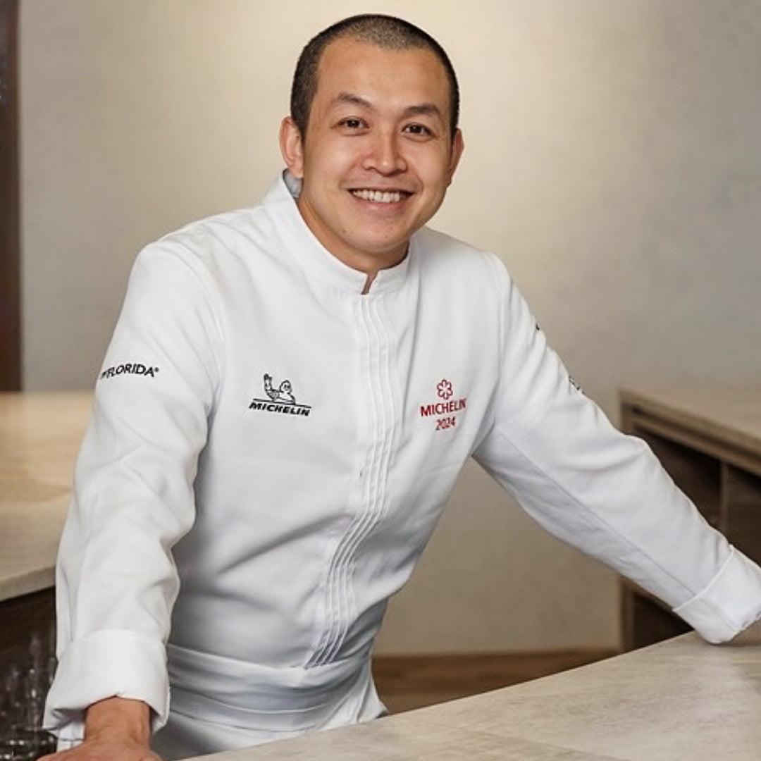 Famous restaurant chef wearing a white chef coat with Michelin embroidery