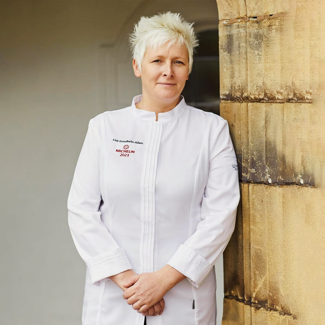Famous woman chef in a Lafont white chef coat with long sleeves 