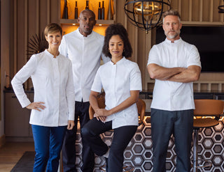 Professional team of executive chefs in a  restaurant in a unified look